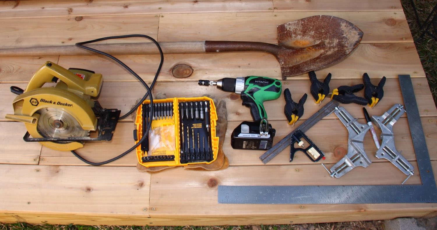 A carpenter's tools laid out on fresh cedar boards at a Reliable Home Solutions job site
